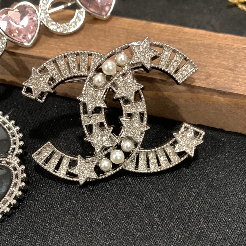 silver star with pearl brooch